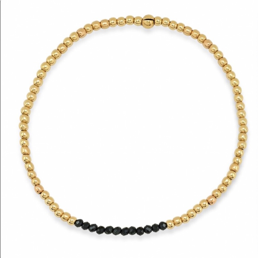 Gold beaded bracelet with black spinel